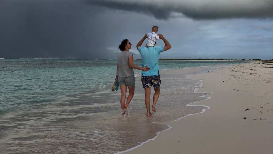 Family walking on the beach