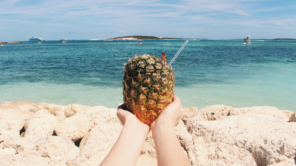 woman holding pineapple