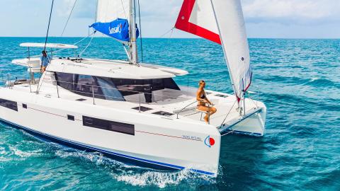 Guest sitting on Sunsail yacht while cruising