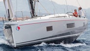 Man and woman sailing Sunsail 524